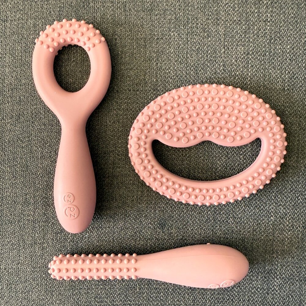 ezpz Oral Development Tools in Blush to Develop Feeding, Biting, Munching + Chew